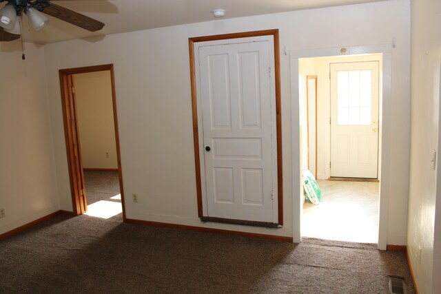 unfurnished room featuring carpet flooring and ceiling fan