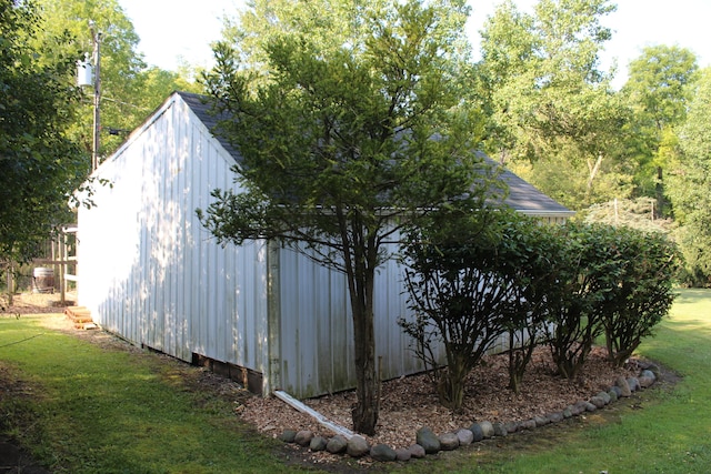 view of outbuilding with a yard