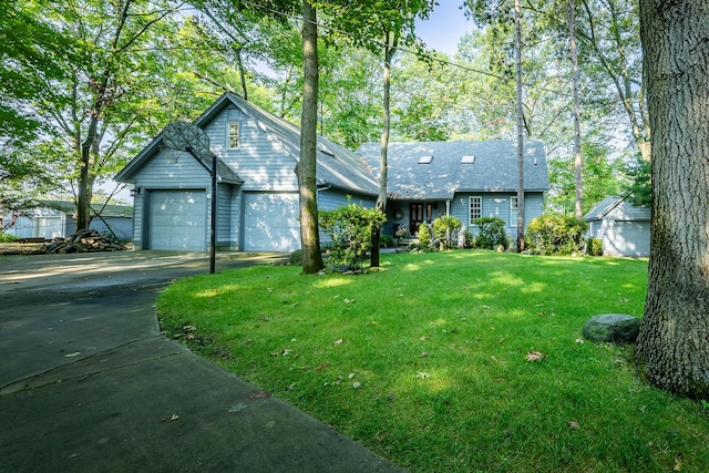 view of front of property featuring a garage and a front yard