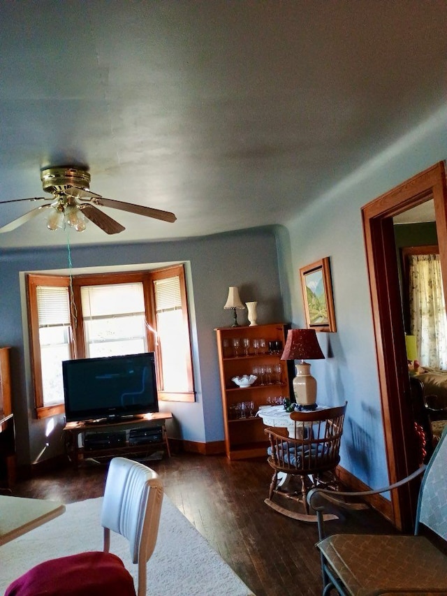 1460 S Dye Rd, Flint, MI 48532 - living room featuring a ceiling fan, baseboards, and hardwood / wood-style floors