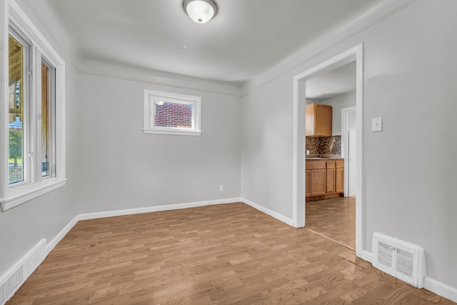 unfurnished room with light hardwood / wood-style flooring