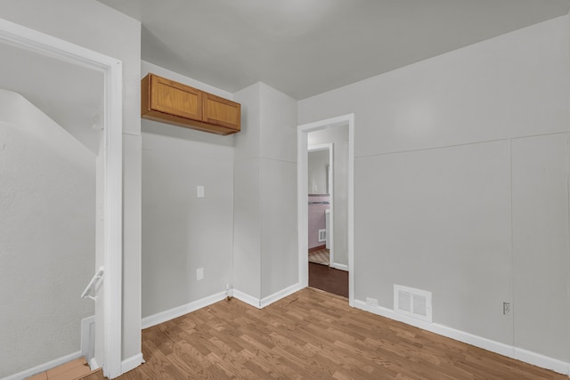 spare room featuring light hardwood / wood-style flooring