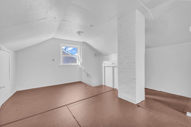 bonus room with vaulted ceiling