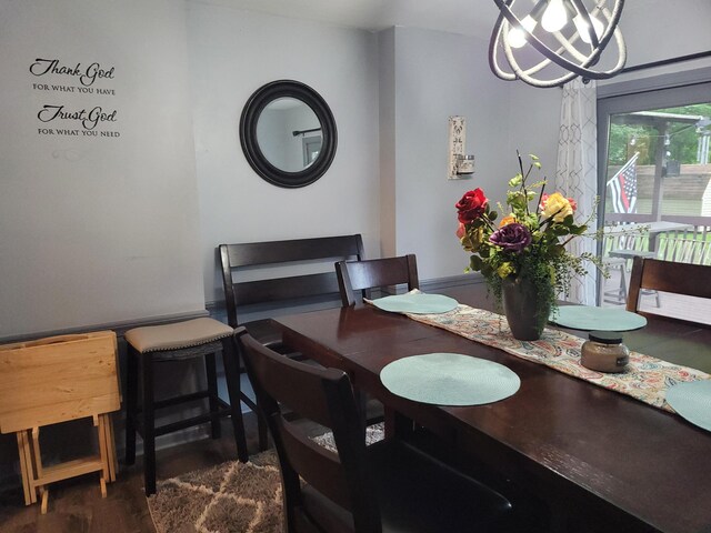 77 Maple Ln, Coldwater, MI 49036 - dining space with a chandelier and dark wood-type flooring