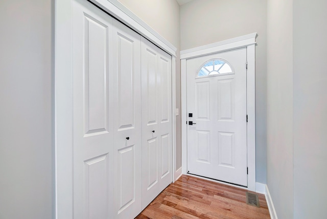 doorway to outside with light wood-type flooring