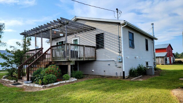 12448 Jefferson Rd, Morley, MI 49336 - rear view of property with a yard, a pergola, a deck, and stairway