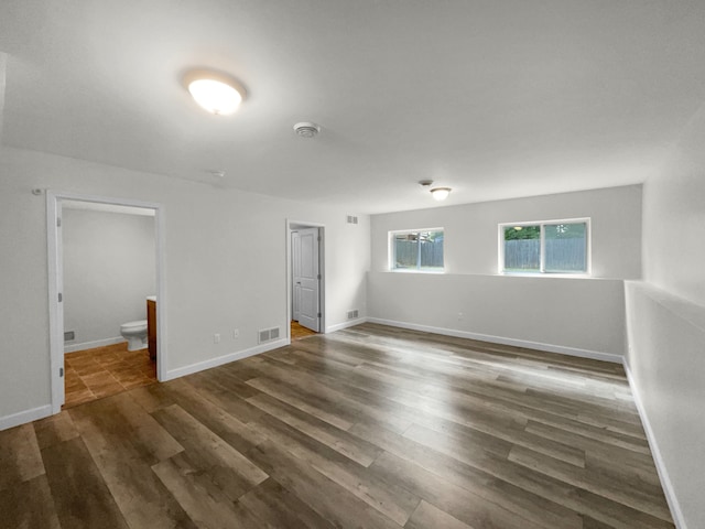 empty room featuring dark wood-type flooring