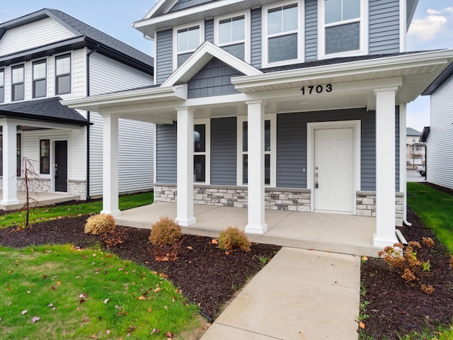 property entrance featuring a porch