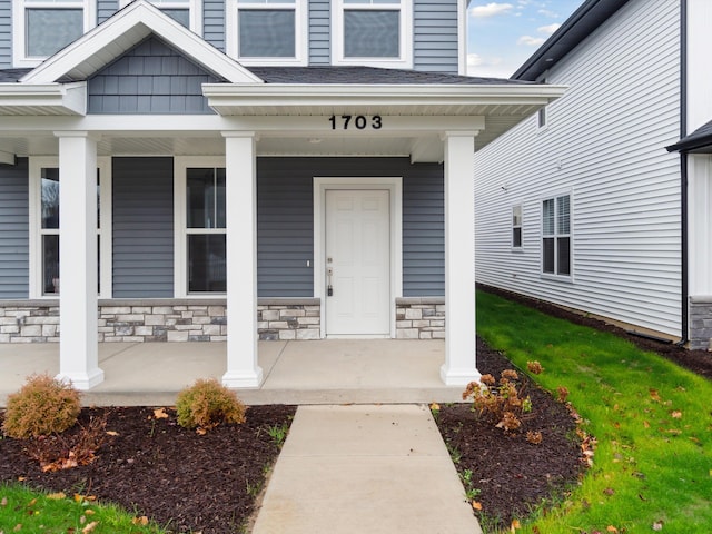 property entrance featuring a porch