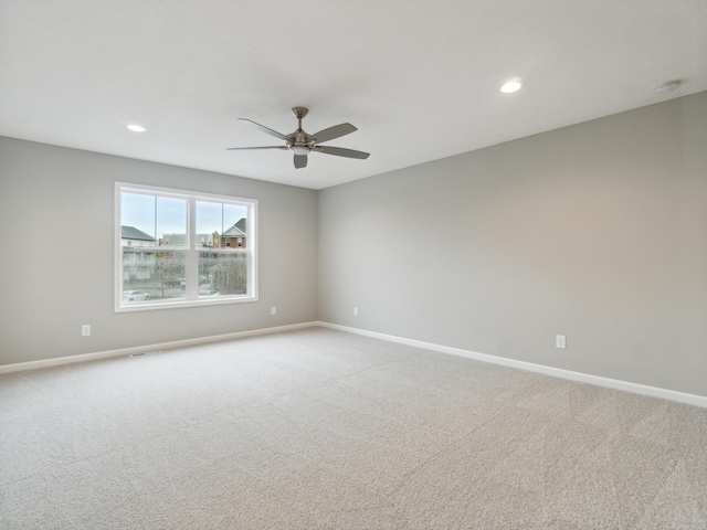 carpeted empty room with ceiling fan