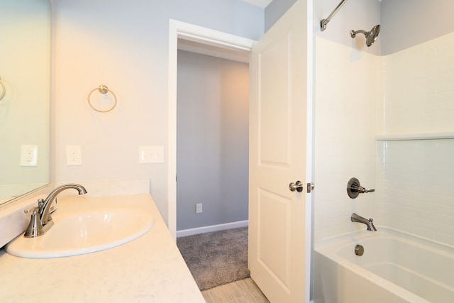 bathroom featuring vanity and  shower combination