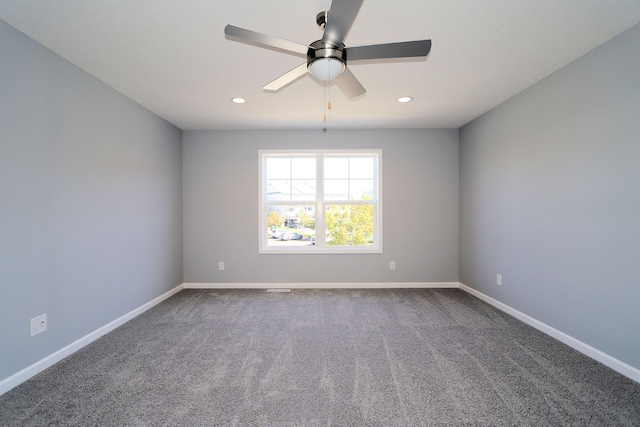 unfurnished room with ceiling fan and carpet floors