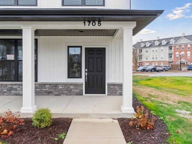 doorway to property with a porch