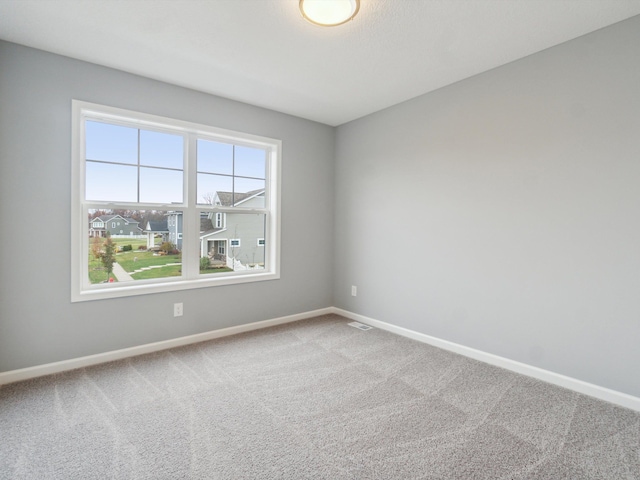 view of carpeted spare room