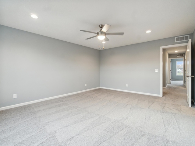 carpeted empty room featuring ceiling fan