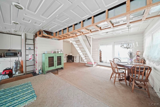 624 Fishermans Wharf, Horton, MI 49246 - below grade area with carpet, stairs, and a chandelier
