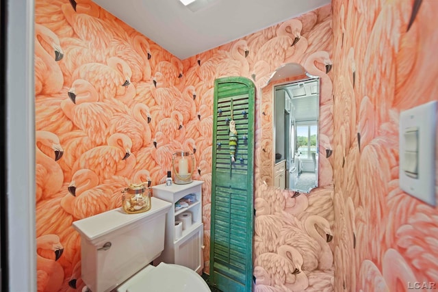 624 Fishermans Wharf, Horton, MI 49246 - bathroom featuring toilet and wallpapered walls