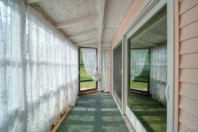 unfurnished sunroom with vaulted ceiling