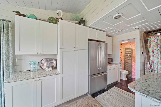 624 Fishermans Wharf, Horton, MI 49246 - kitchen featuring appliances with stainless steel finishes, white cabinetry, and light stone counters
