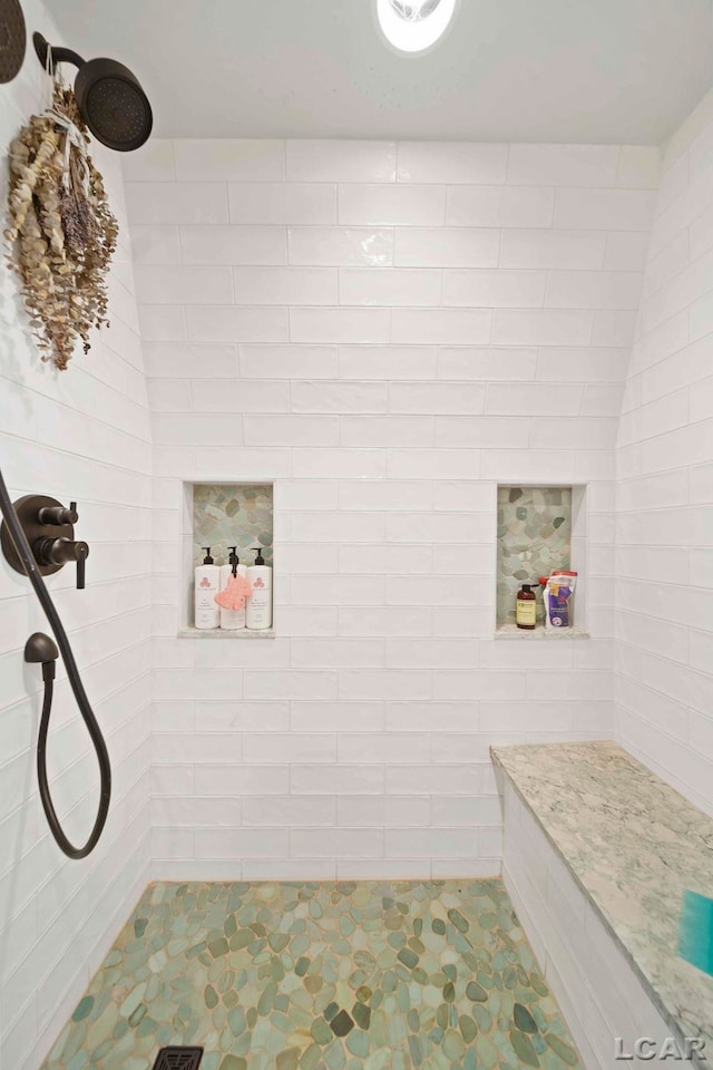 624 Fishermans Wharf, Horton, MI 49246 - bathroom featuring a tile shower