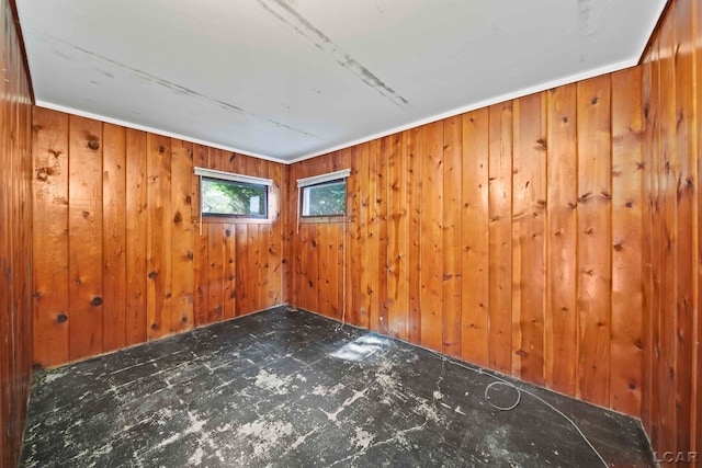 empty room featuring wooden walls