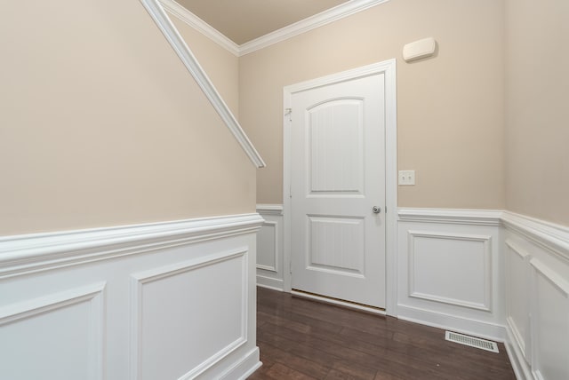 hall featuring dark hardwood / wood-style floors and ornamental molding