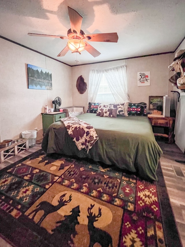 bedroom featuring ceiling fan and hardwood / wood-style floors