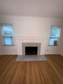 14257 Warwick St, Detroit, MI 48223 - detailed view of wood finished floors and a fireplace with flush hearth