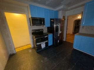 14257 Warwick St, Detroit, MI 48223 - kitchen featuring appliances with stainless steel finishes, blue cabinets, and arched walkways