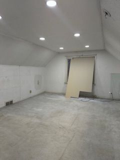 14257 Warwick St, Detroit, MI 48223 - additional living space featuring vaulted ceiling and recessed lighting