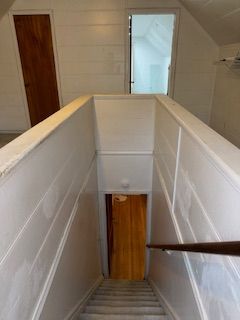 14257 Warwick St, Detroit, MI 48223 - stairs featuring vaulted ceiling