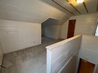 14257 Warwick St, Detroit, MI 48223 - bonus room featuring vaulted ceiling and carpet flooring