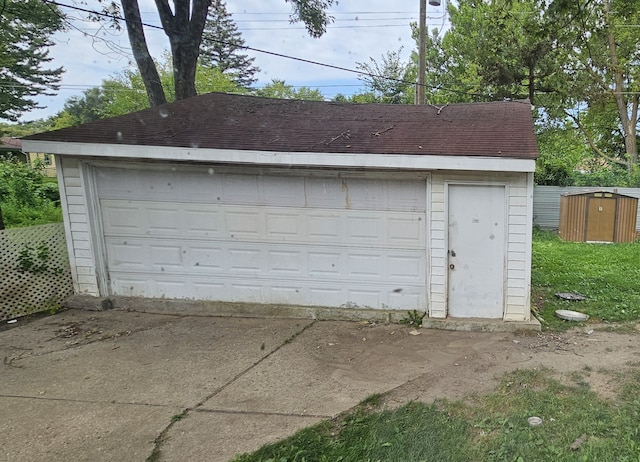 5817 Winthrop Blvd, Flint, MI 48505 - detached garage featuring a shed