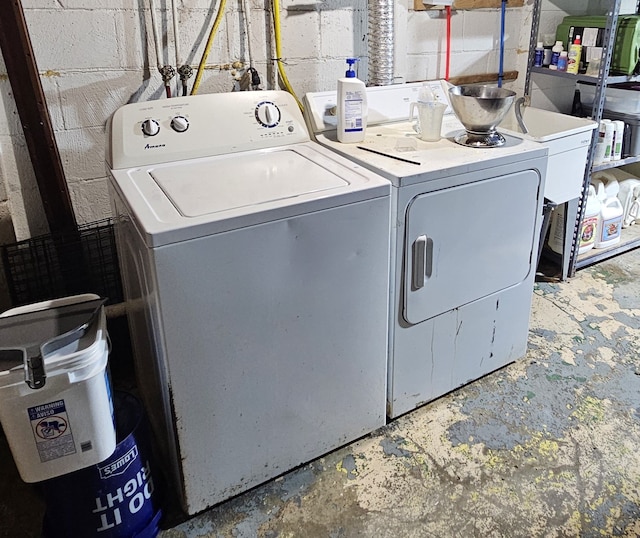 clothes washing area with independent washer and dryer