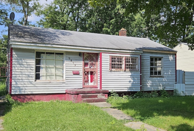 view of front of home with a front yard