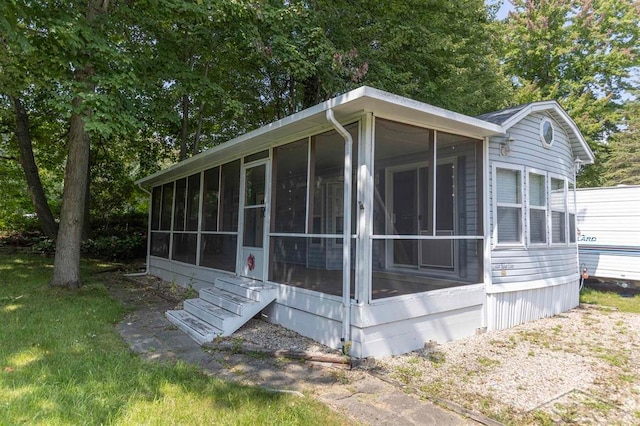 view of home's exterior featuring a sunroom