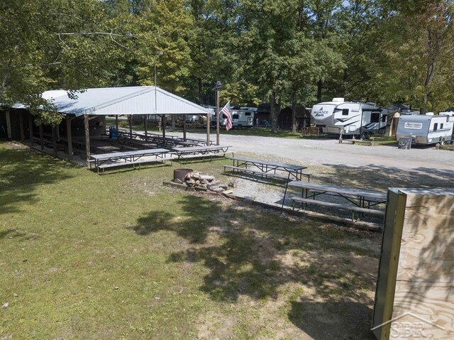 978 Timberlynn Trl, Sanford, MI 48657 - view of grassy yard with a gazebo and view of wooded area