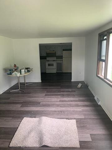 unfurnished room featuring dark hardwood / wood-style floors