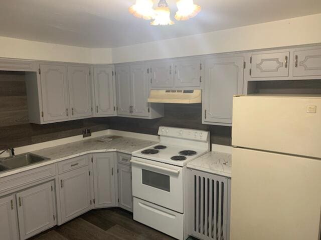 kitchen featuring white cabinets, dark hardwood / wood-style floors, white appliances, and sink