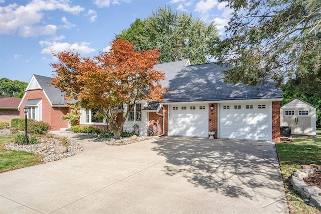 view of front of house with a storage unit and a garage