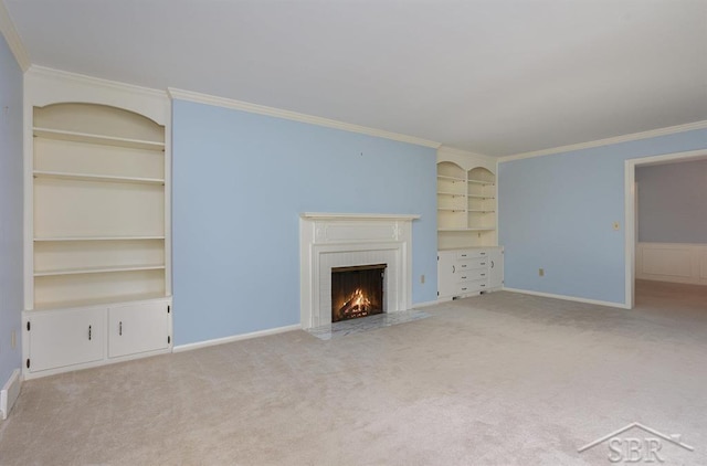 unfurnished living room featuring a fireplace, built in shelves, light colored carpet, and crown molding