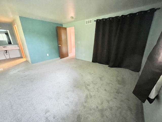 unfurnished bedroom featuring carpet