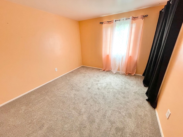 unfurnished room with carpet flooring