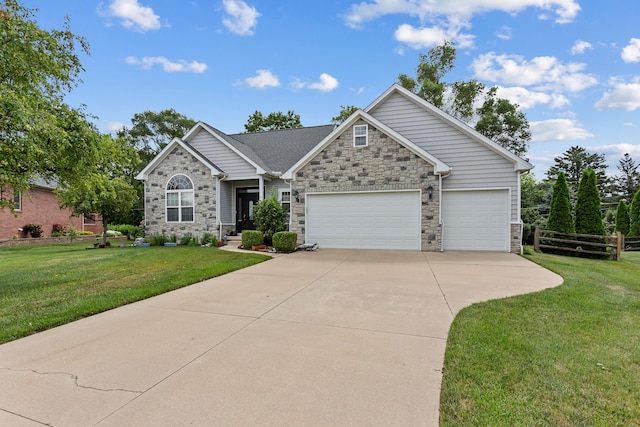 view of front facade featuring a garage and a front lawn