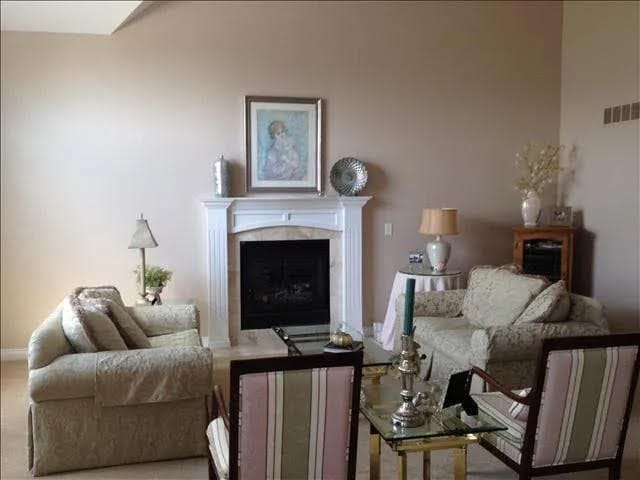 living room with a tiled fireplace