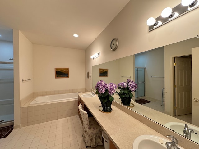 bathroom featuring vanity, separate shower and tub, tile patterned floors, and lofted ceiling