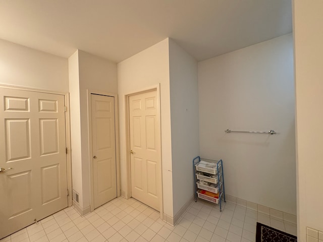 bathroom with tile patterned floors