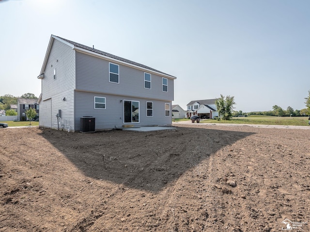 back of property featuring a patio area and central AC