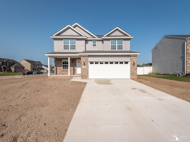 craftsman-style home with covered porch and a garage