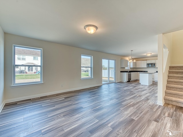 unfurnished living room with light hardwood / wood-style flooring